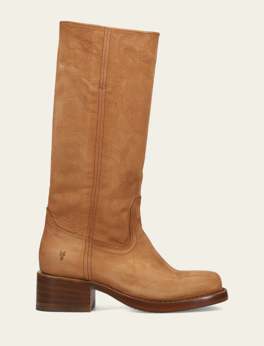 Tan knee-high boot on a light beige background