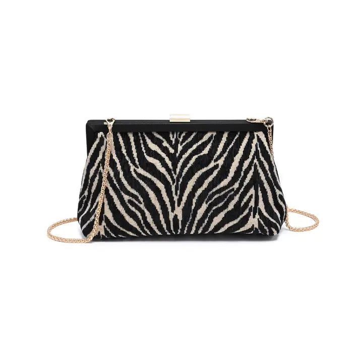 A zebra-print clutch bag with a black and beige textured pattern, featuring a gold-tone metal clasp and a gold-tone chain shoulder strap, shown against a plain white background.