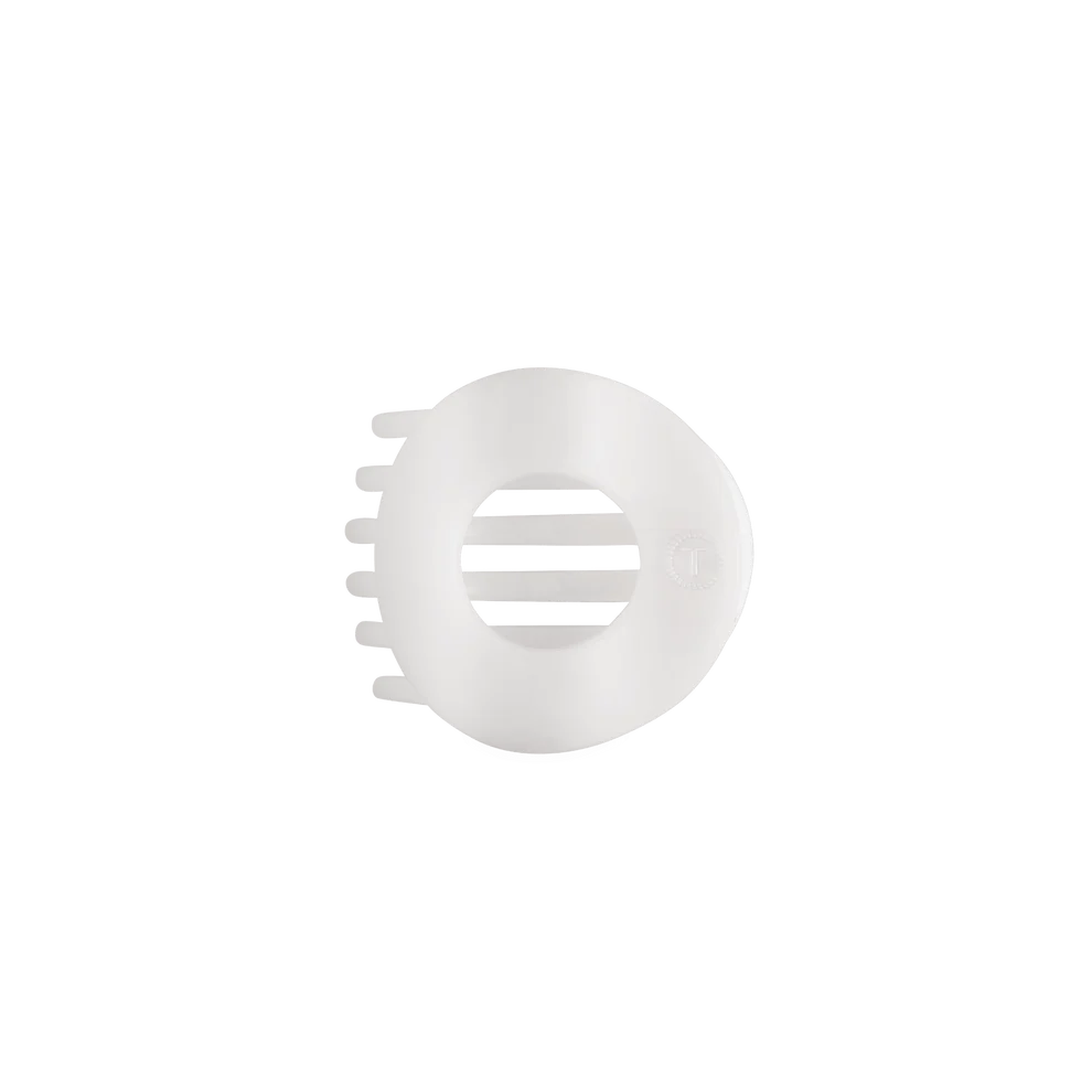 A white plastic hair guard or hair cap with ventilation slots, shown on a solid white background.