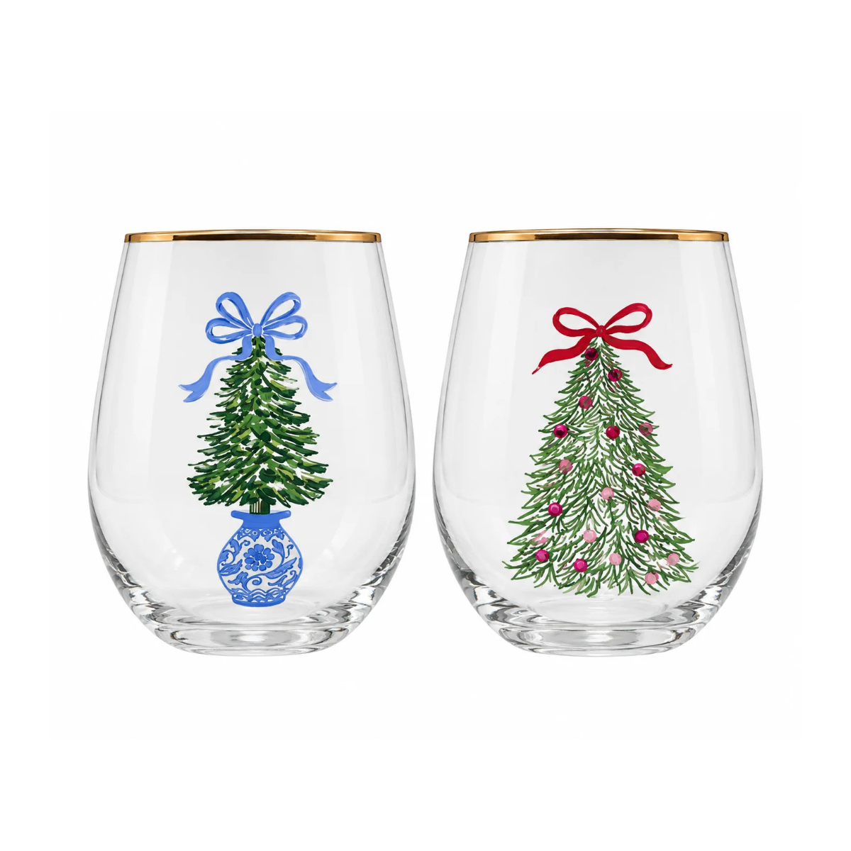 Two clear stemless wine glasses with gold rims, each decorated with a Christmas tree illustration. The left glass has a green tree with a blue bow and blue floral vase, and the right glass has a green tree with pink ornaments and a red bow.
