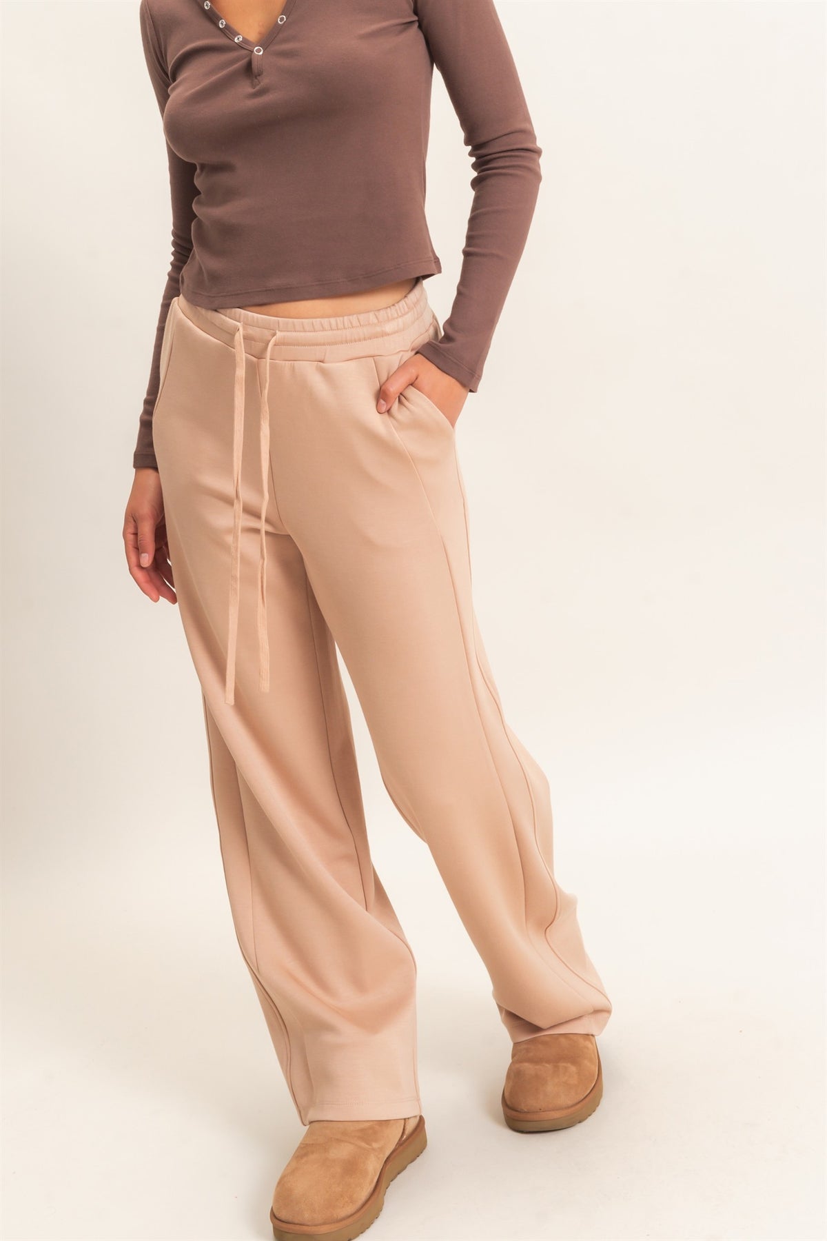 woman modeling taupe colored lounge straight leg pants 