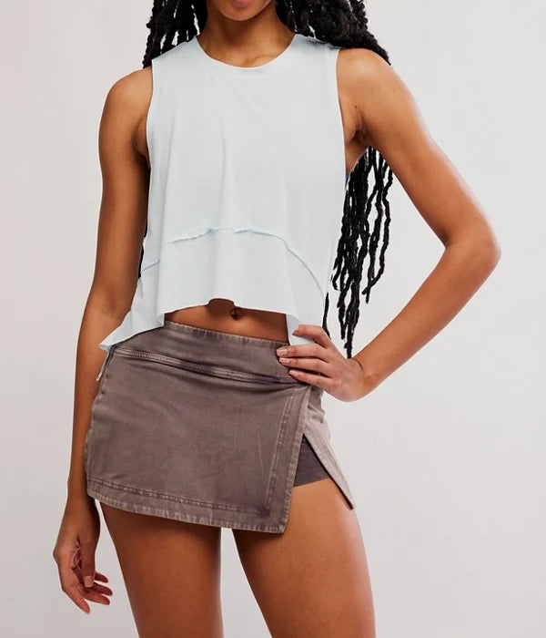 Woman modeling brown colored skirt and light colored tank top