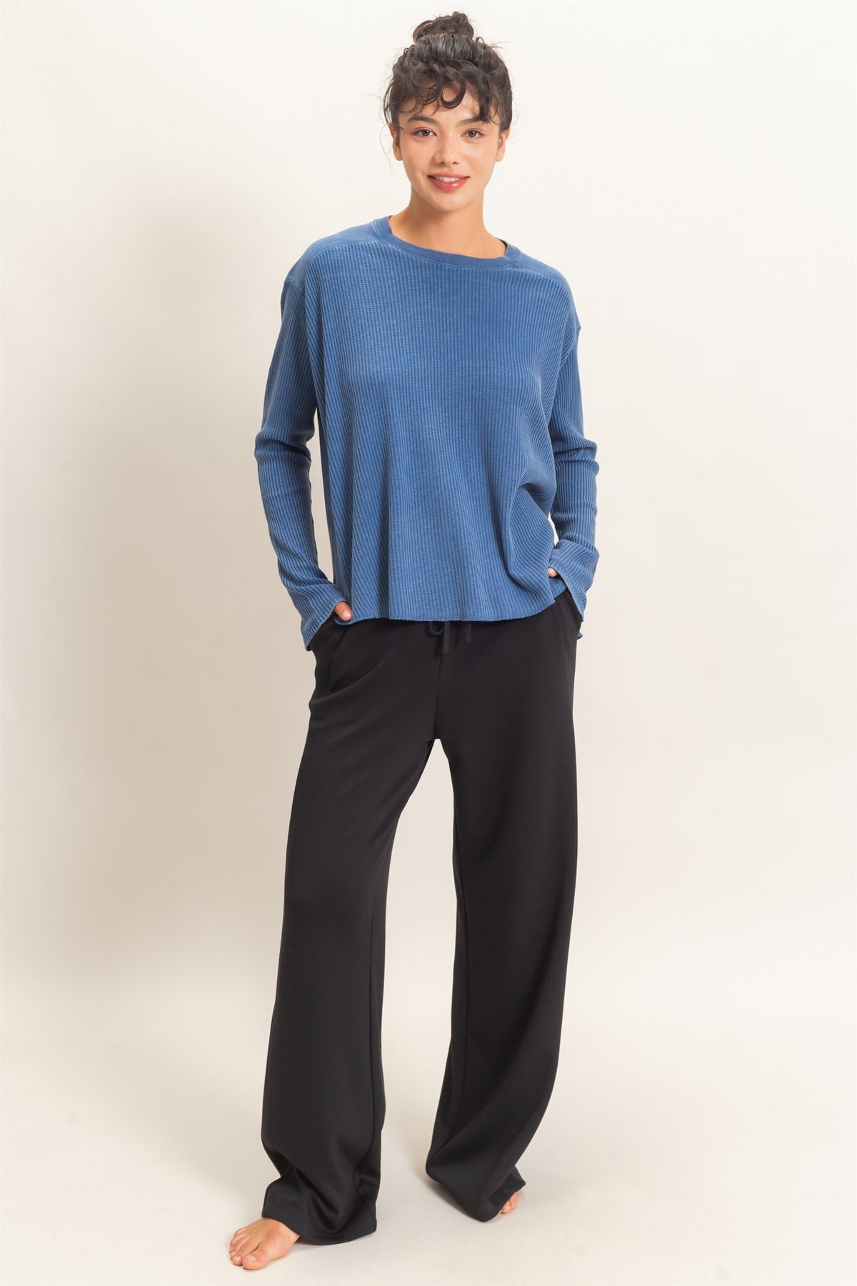 woman modeling lounge straight leg pants and blue waffle knit top 