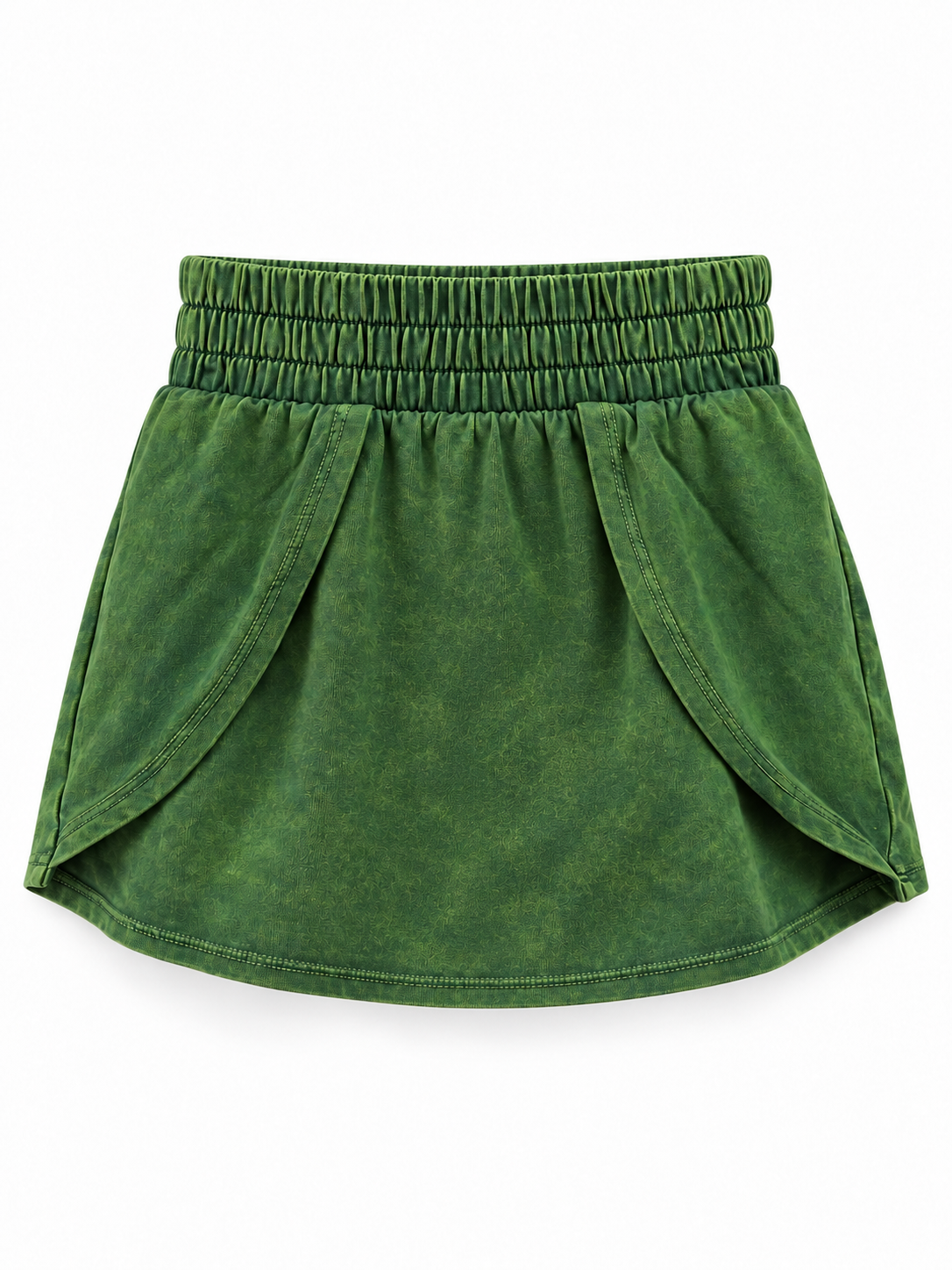 Moss green mineral-wash skort with a wide elastic waistband, curved overlapping side panels, and a rounded hem on a white background.