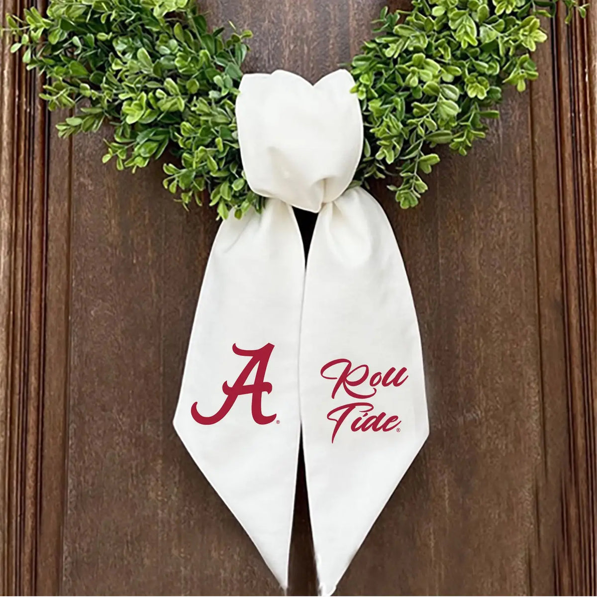 wreath on door with alabama a on a sash 