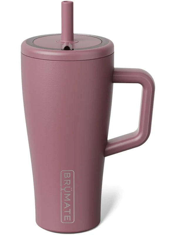 A matte dusty rose insulated travel tumbler with a matching handle, lid, and straw, featuring the vertical BRUMATE logo near the bottom, set against a plain white background.