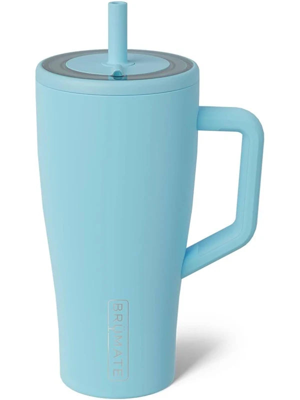 A light blue insulated travel tumbler with a matching handle, lid, and straw, featuring a vertical PRIMALATE logo near the bottom, set against a plain white background.