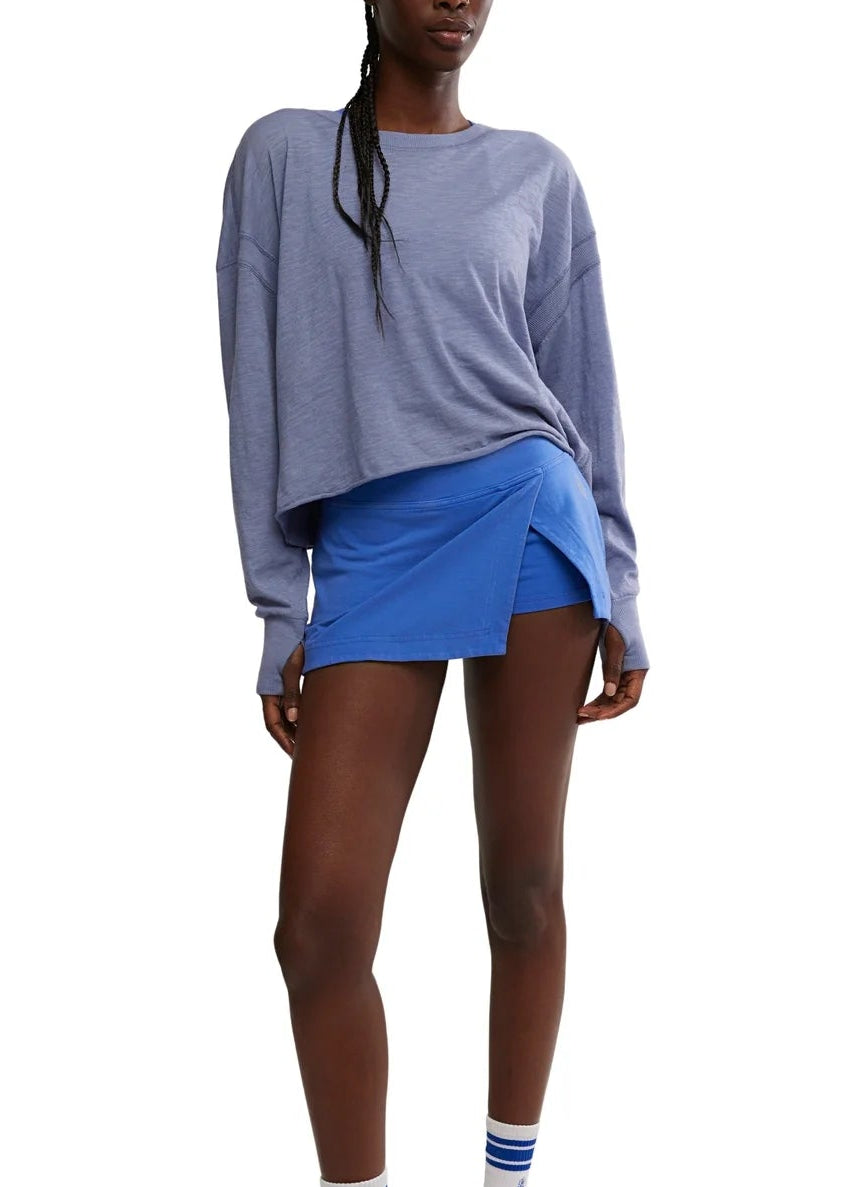Woman modeling blue skort and top