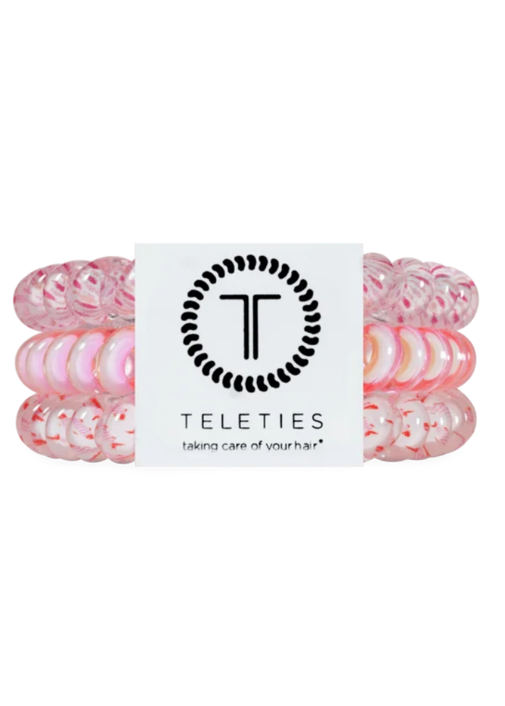Set of pink hair ties with a Teleties label on a white background