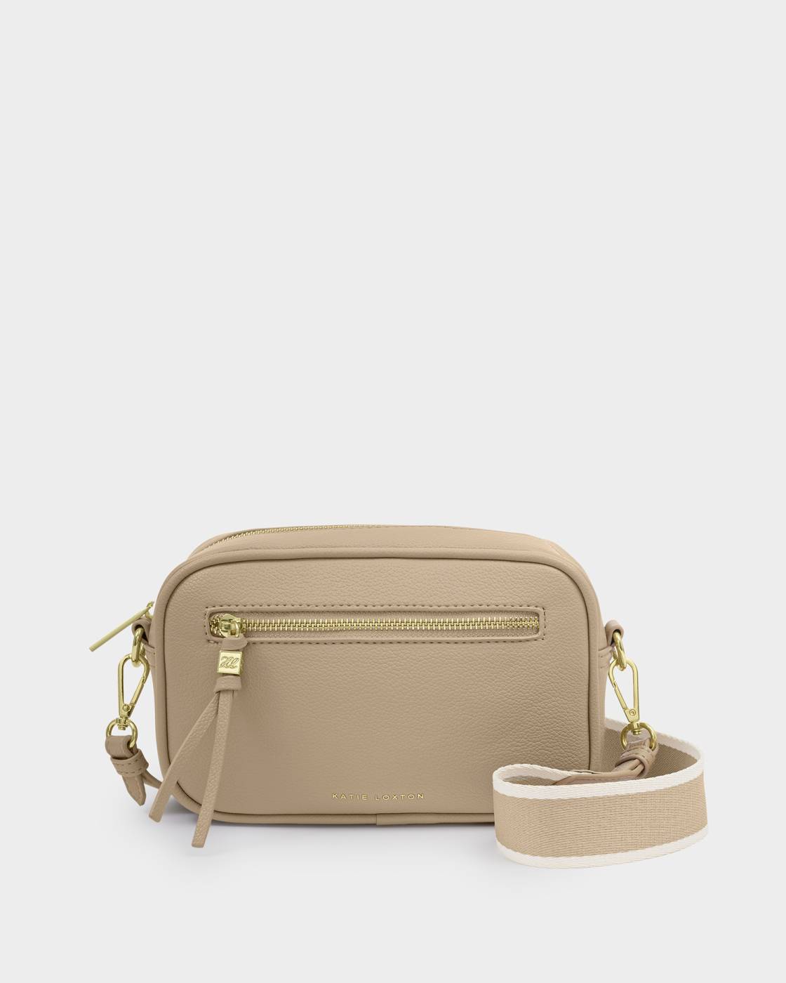 Beige crossbody bag with gold zipper on a light gray background
