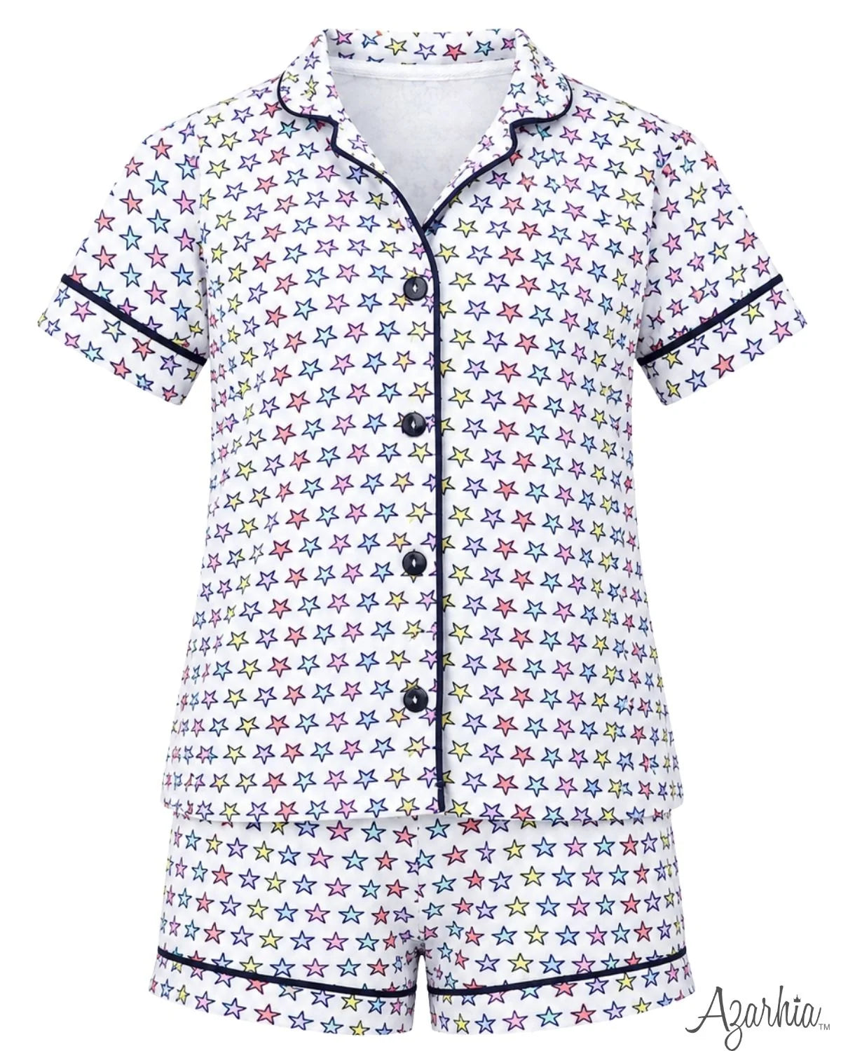 A short-sleeve pajama set with a white base covered in a colorful star pattern, featuring dark navy piping along the collar, placket, cuffs, and hem. The set includes a button-front top and matching shorts.