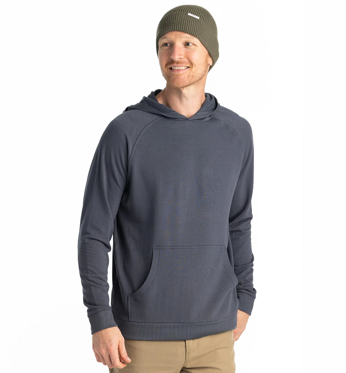 Man wearing a gray hoodie and green beanie on a white background