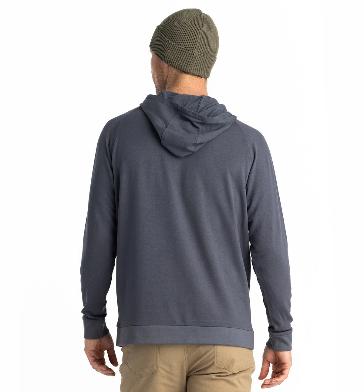 Person wearing a gray hoodie and green beanie from behind on a white background