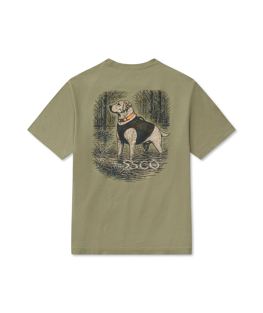 An olive green short-sleeve t-shirt shown from the back, featuring a large graphic print of a bulldog in a forest with the text 'SSCO' underneath.