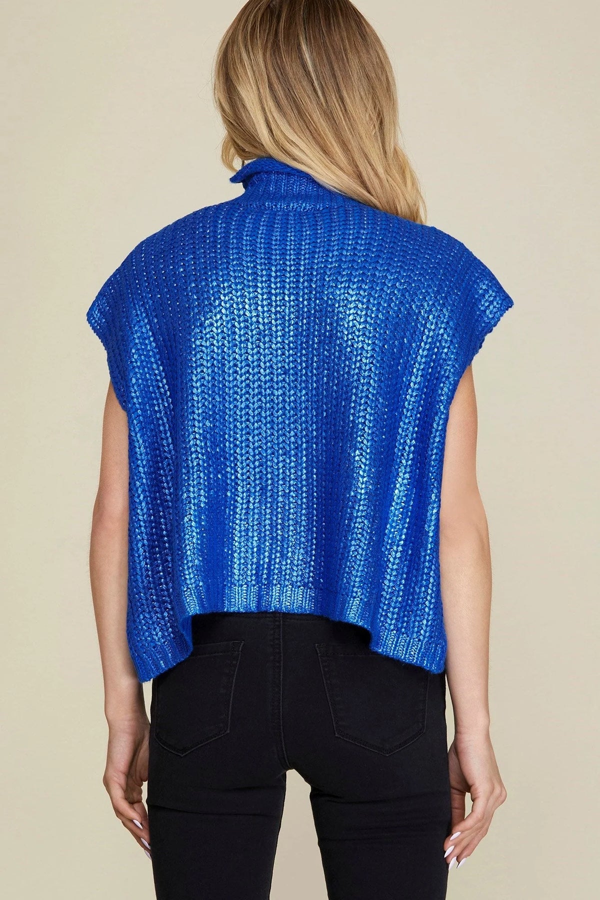 girl in blue metallic sweater 