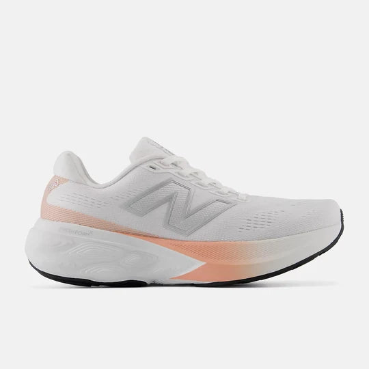 White and pink running shoe on a light gray background