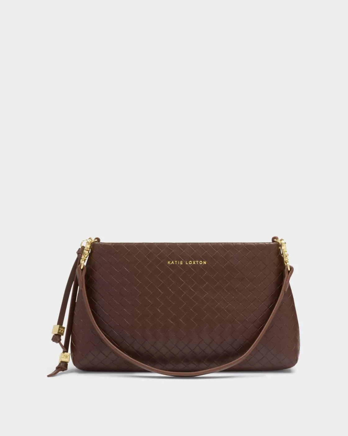 Brown handbag with a strap on a light gray background