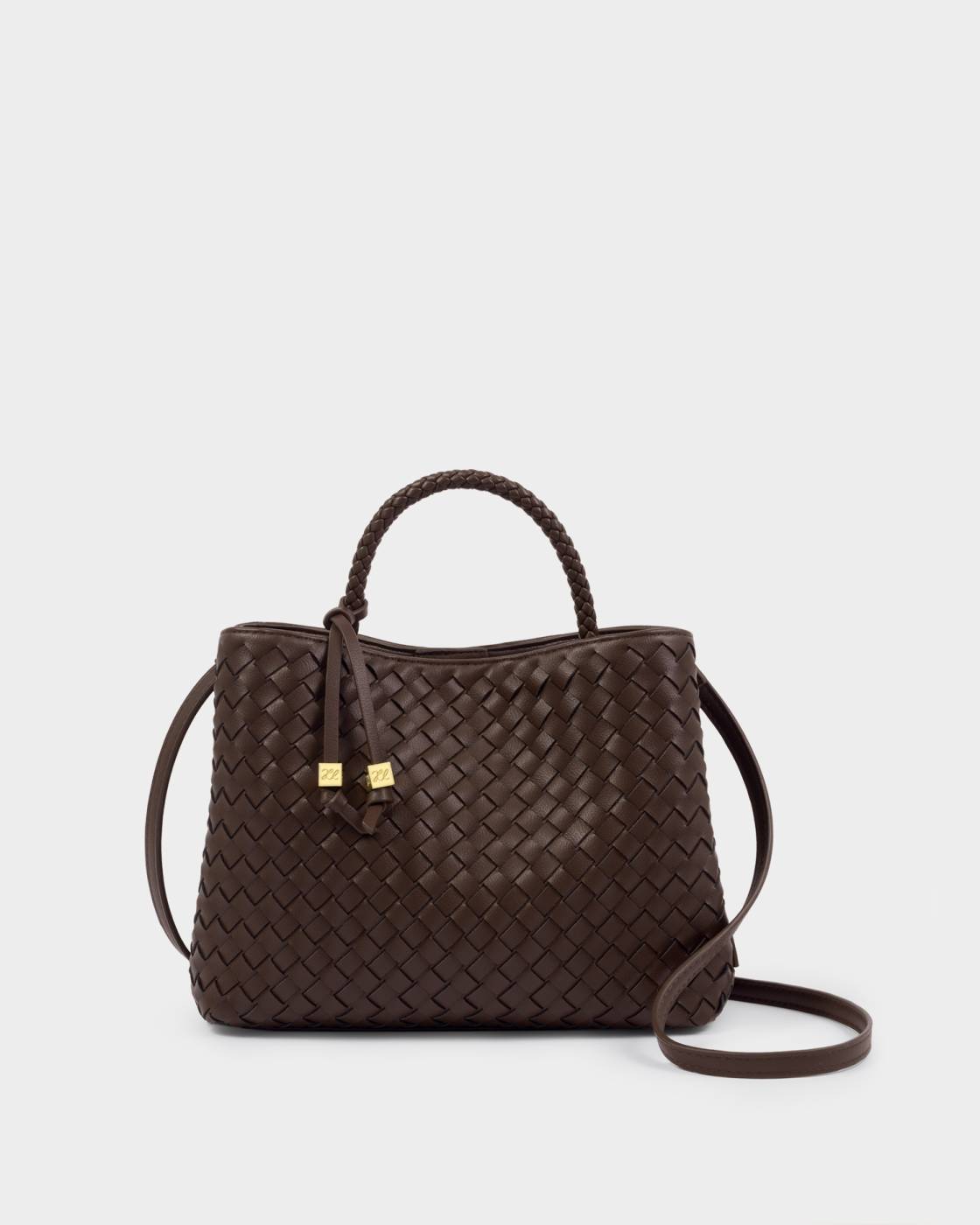 Brown woven handbag with a strap on a light gray background