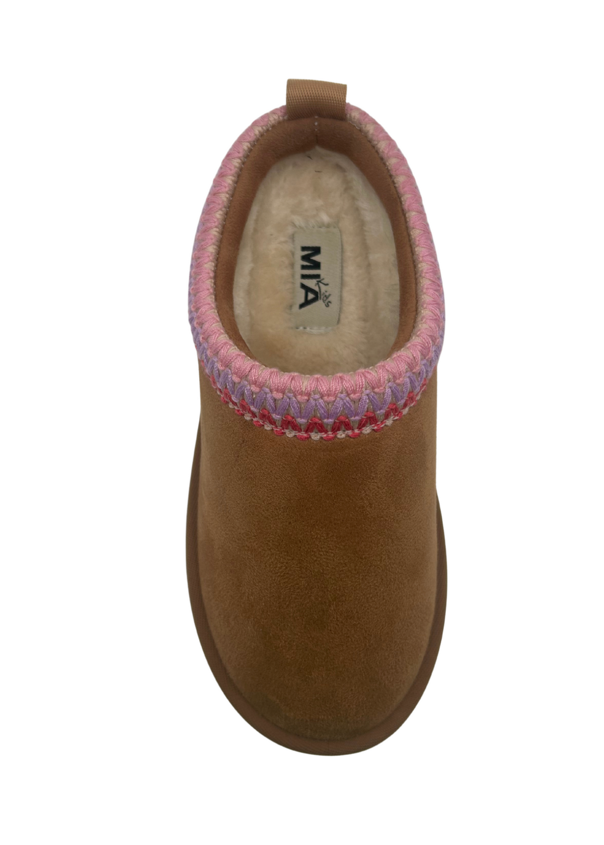 Girls brown slipper with pink stitching at ankle on a white background. 