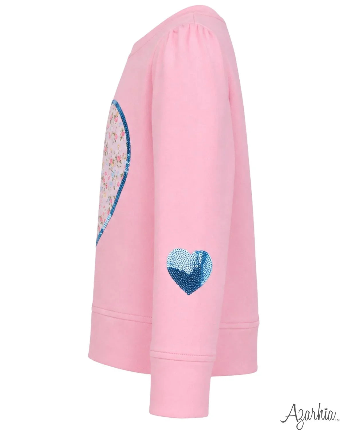 A pink long-sleeve sweatshirt shown from the side, featuring a large sequined heart on the back and a smaller blue sequined heart on the sleeve. The brand name 'Agarkia' is visible in the bottom right corner.