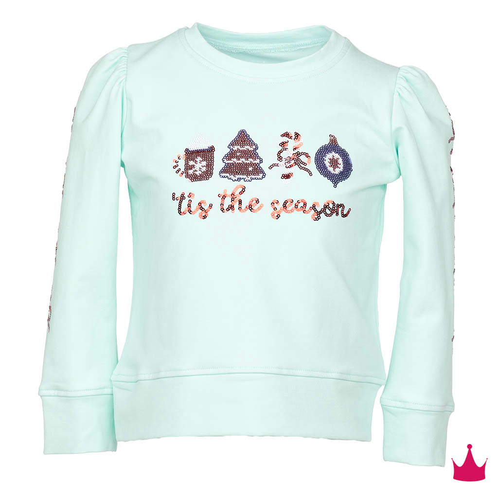 A mint green long-sleeve sweatshirt for kids, featuring sequined holiday graphics on the chest including a cat, Christmas tree, Santa, ornament, and the phrase 'Tis the season'. The sleeves have puff sleeves with sequined details down the sides.