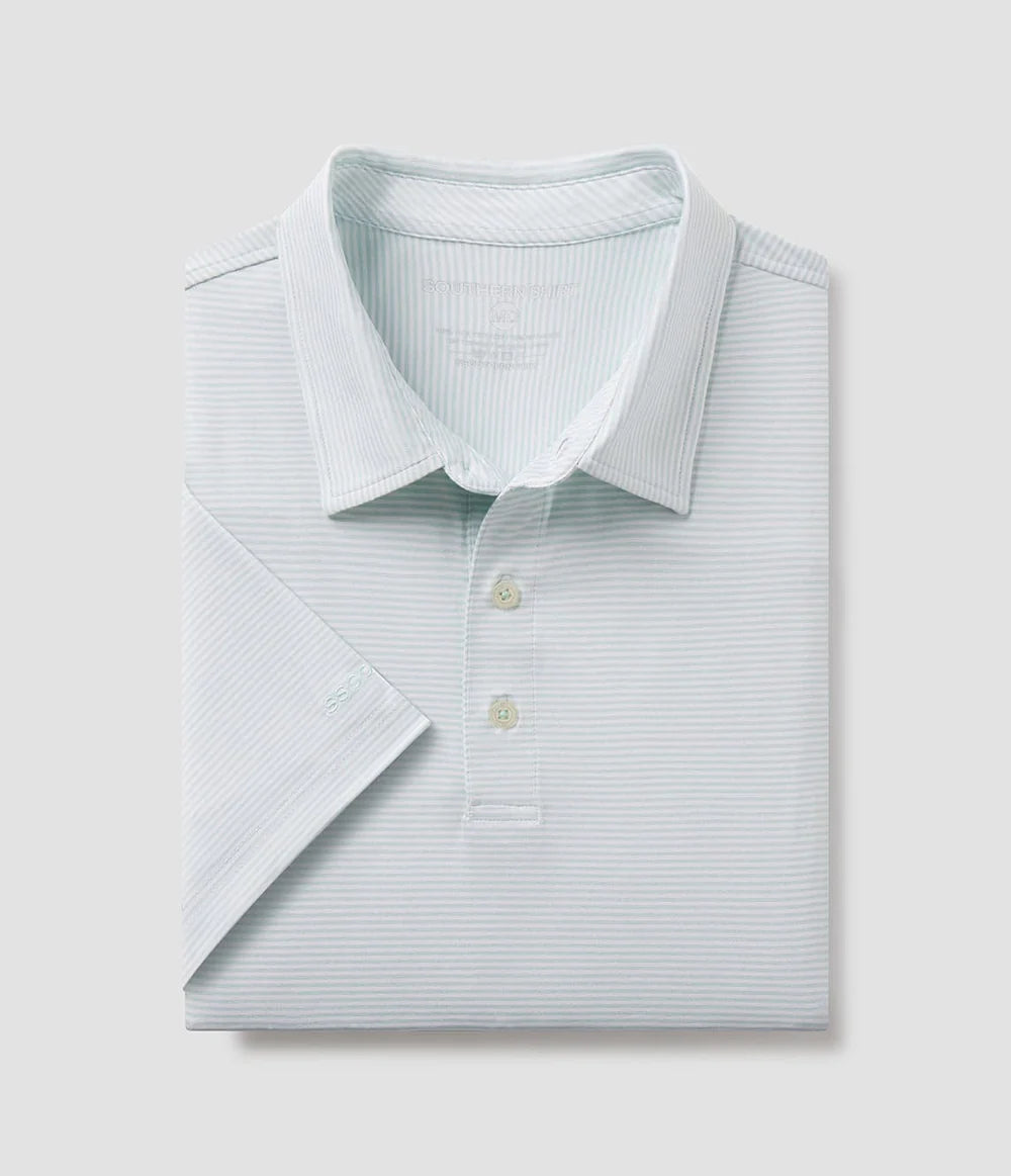 folded green and white striped polo