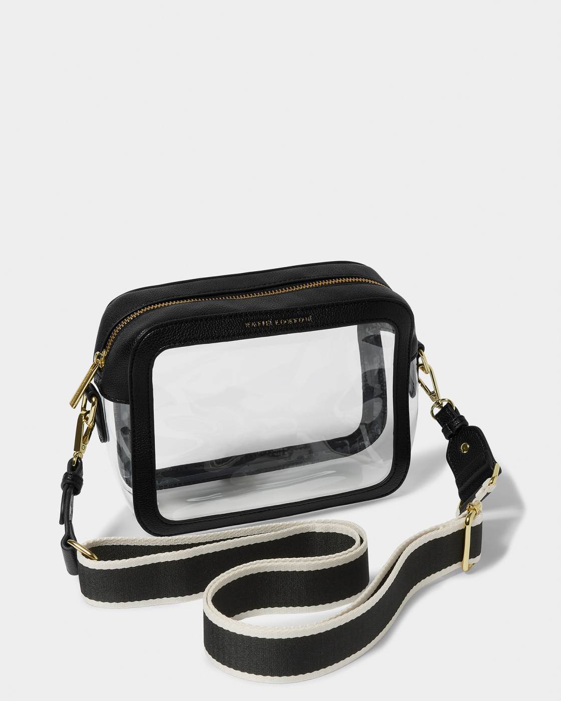 Clear crossbody bag with black strap and visible brand name on a white background