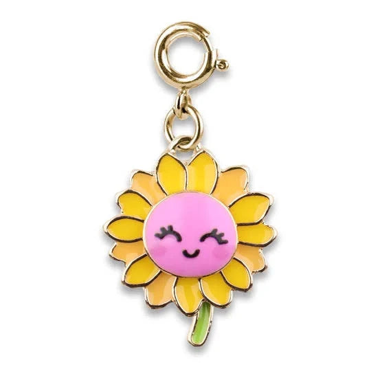 A cute sunflower charm with a smiling pink face, yellow petals, a green stem, and a gold clasp, shown on a plain white background.