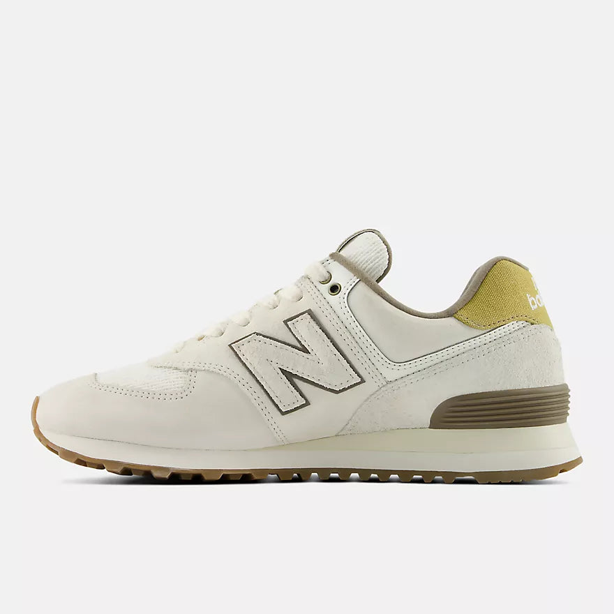 White sneaker with brown accents on a white background